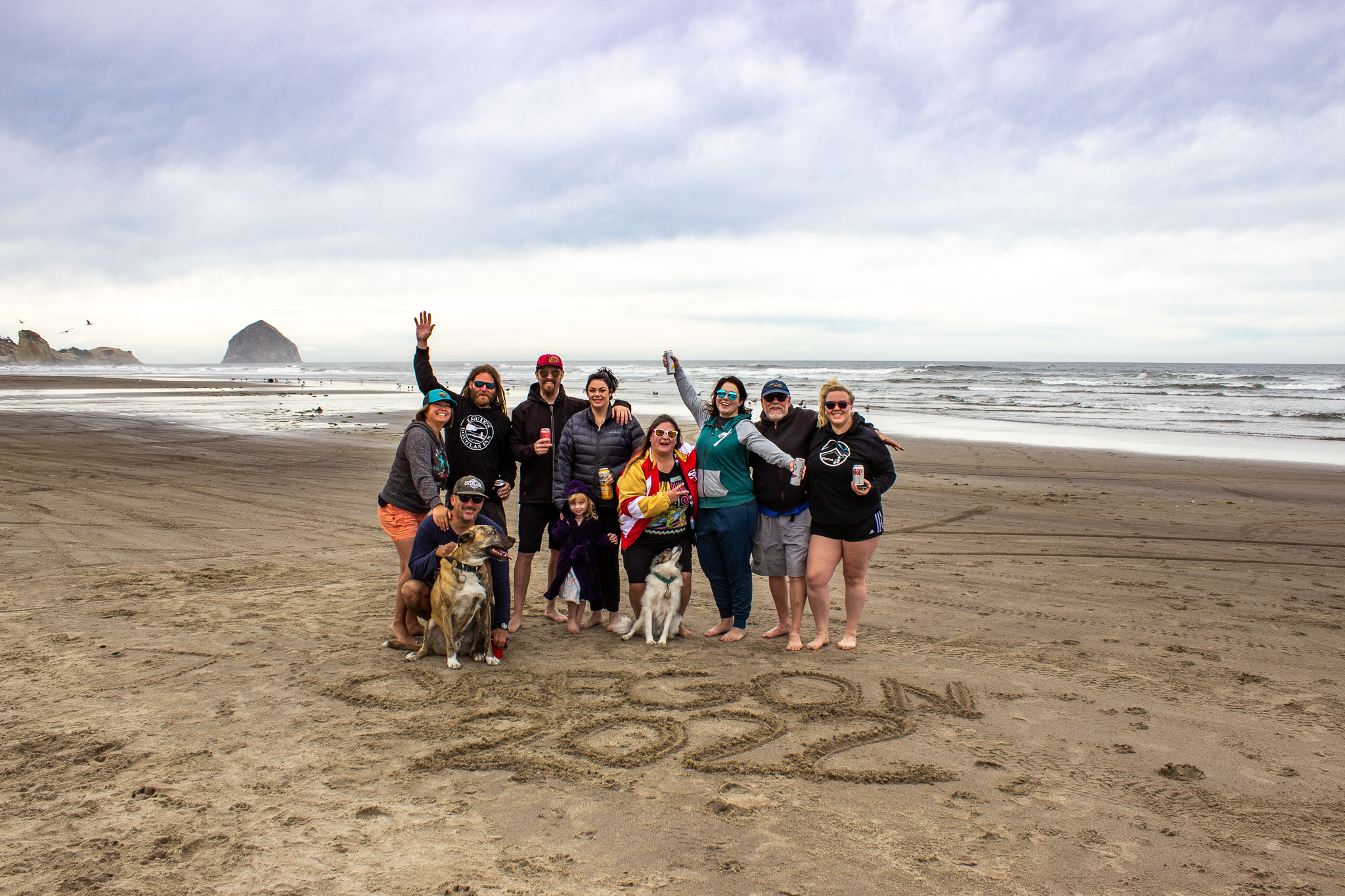 Group on McPhillips Beach in Pacific City, Oregon with Haystack Rock in the background